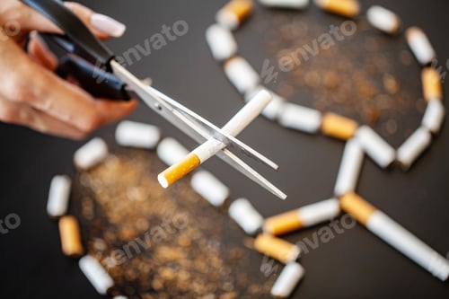 Preview: Stop smoking concept on background with broken cigarettes. Heap of cigarettes. No smoking