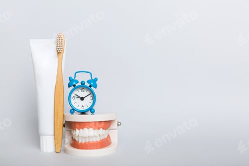 Preview: Mouthwash and other oral hygiene products on colored table top view with copy space.