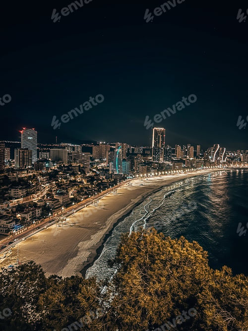 Preview: Coastline of Benidorm with illuminated buildings at night. Spain