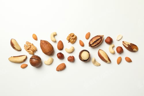Preview: Different tasty nuts on white background, space for text