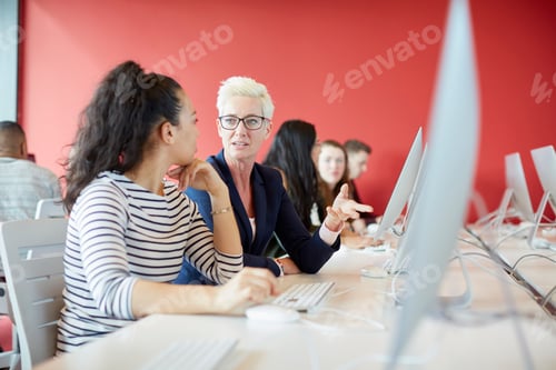 Preview: University students working at computer in class