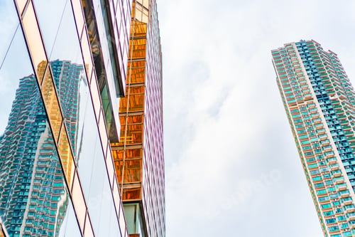 Preview: HONG KONG, CHINA - January, 2021 : Golden tall buildings and glass reflections in Hong Kong Island