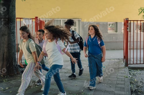 Preview: Happy pupils leaving school after class, walking and running