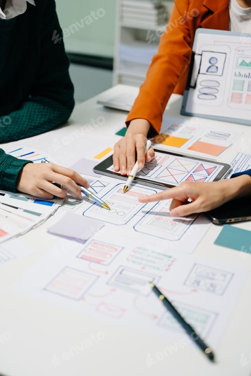Preview: UX developer and ui designer brainstorming about mobile app interface wireframe design