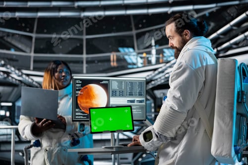 Preview: Space station researchers analyzing Mars planetary data using mockup tablet