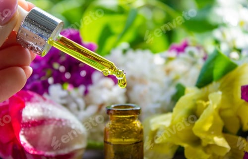 Preview: Essential oil extract of herbs and flowers. Selective focus