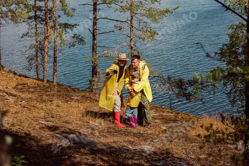 Preview: Dad, mom, and child are walking around the stone island admiring nature
