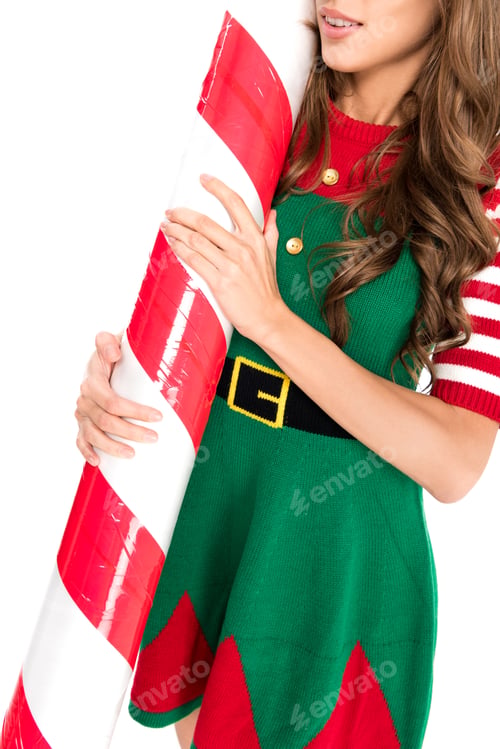 Preview: cropped shot of woman in elf costume holding decorative Christmas lollipop isolated on white