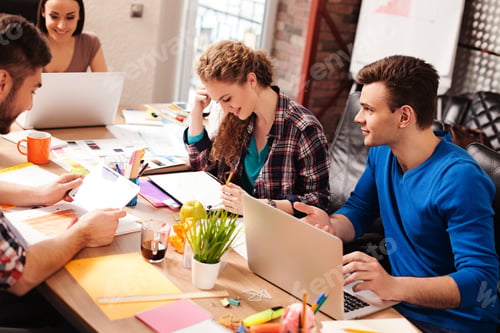 Preview: Cheerful Four Colleagues Are Discussing New Project