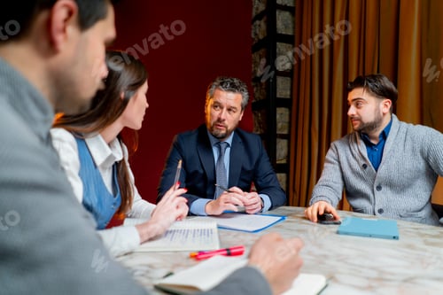 Preview: office workers are sitting at the head of the director discussing a business plan