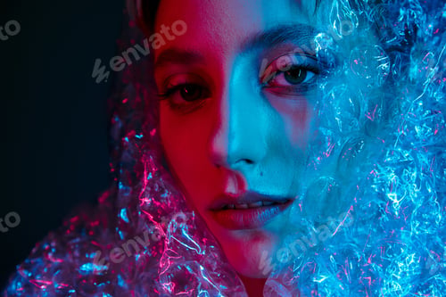Preview: A Woman's Face Illuminated by Neon Lights