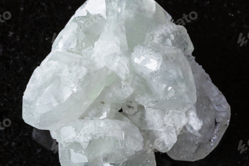Preview: sample of raw datolite mineral on black granite