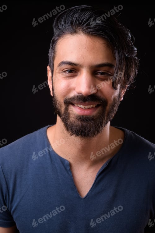 Preview: Face of happy handsome bearded Persian man smiling
