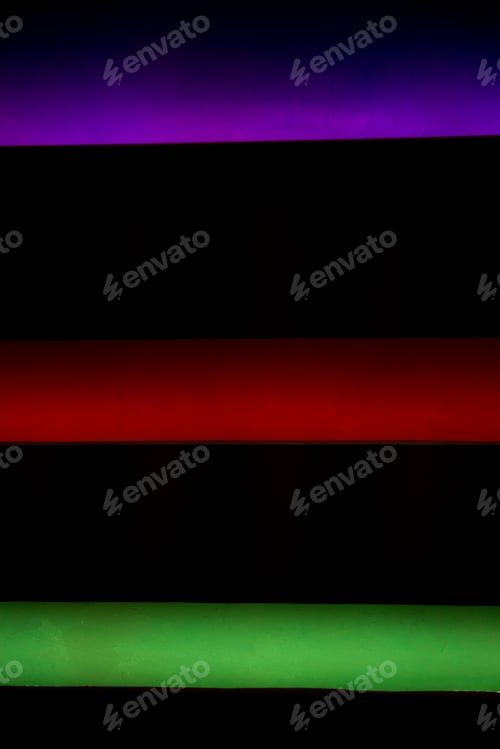 Preview: Multicolor neon color lights on black background.