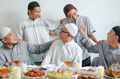 Preview: Multi Generation Muslim Family Laughing Together With Indonesian Traditional Food On The Table