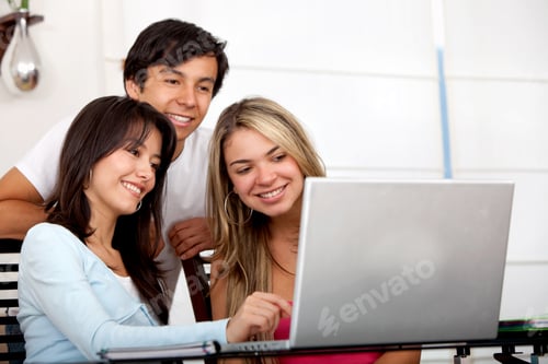 Preview: Group Of Friends Working On A Computer At Home