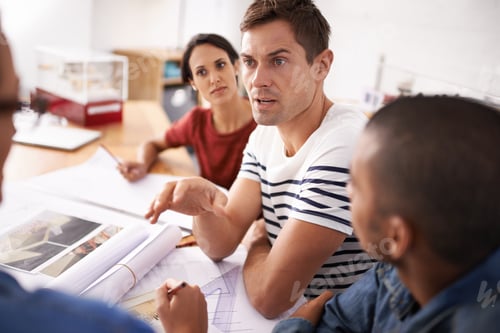 Preview: Business Team Discussing Project at Modern Office Table