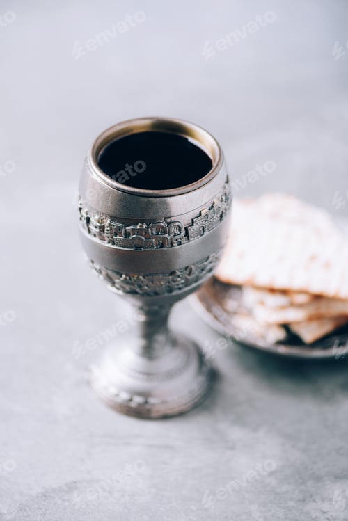 Preview: Jesish kiddush wine cup for passover with matzot, matzo bread. Pesah holiday. Banner with copy space
