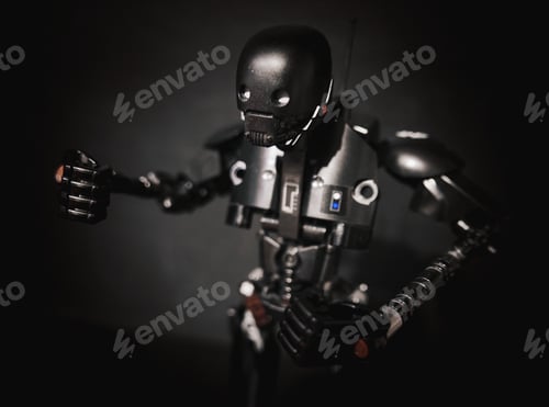 Preview: Black robot toy in front of a black background. K2SO character from Star Wars.