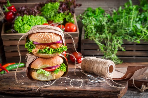 Preview: Takeaway homemade burgers on old wooden table