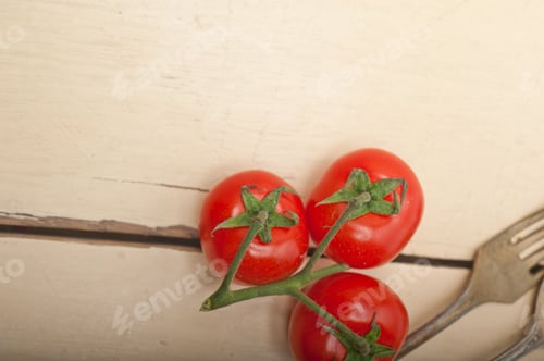 Preview: ripe cherry tomatoes over white wood
