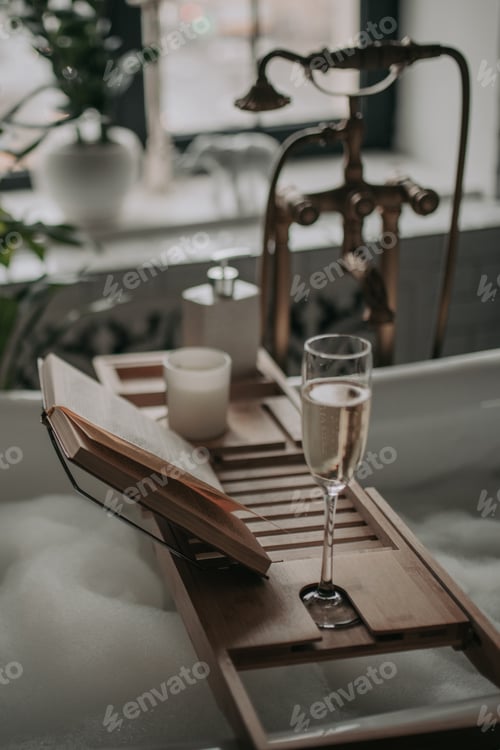 Preview: Luxurious interior bathroom in modern eco style with oval bathtub and book on bamboo wood tray