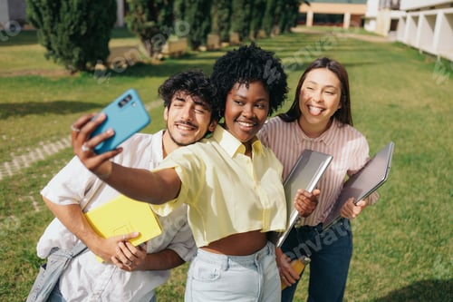 Preview: Multiethnic students taking selfie at univeristy campus before classes begin.