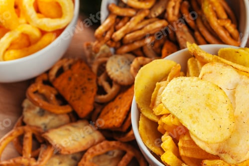 Preview: Beer snacks on stone and wooden background. Top view, copy space