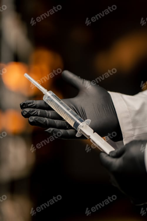 Preview: mushroom farm mycologist in gloves holding syringe with mushroom seeds growing natural products