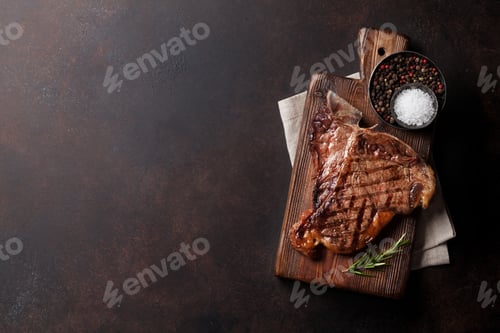 Grilled Steak with Spices on Cutting Board