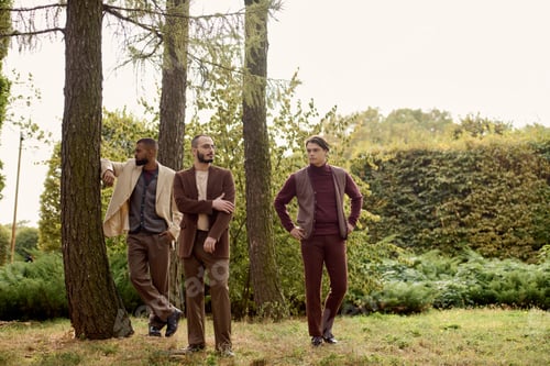 Preview: Handsome men in stylish autumn attire enjoying a tranquil natural setting in a golden field