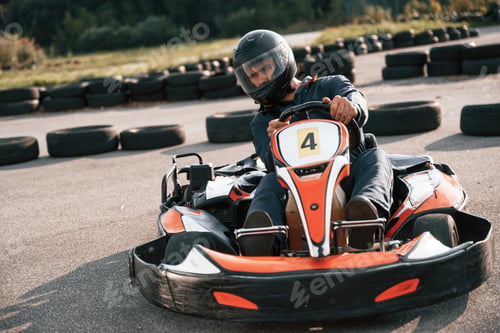Preview: Competition, riding. Man is outdoors, kart racing conception