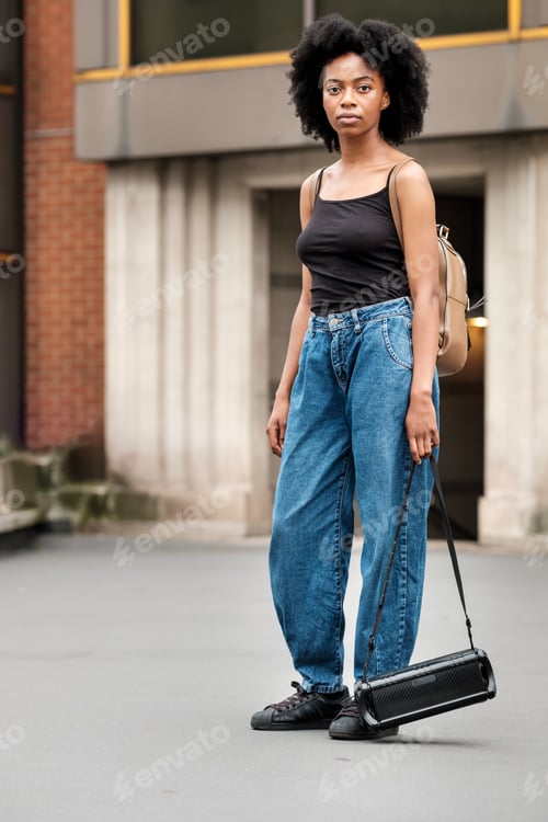 Preview: Confident black dancer in a messy urban environment.