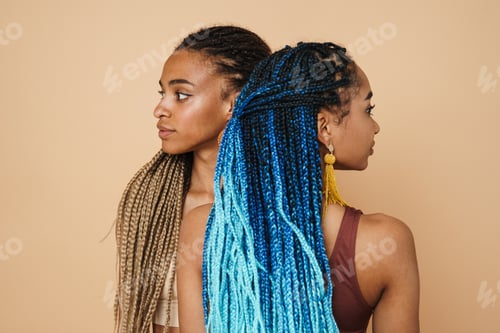 Preview: Young black two women with afro pigtails looking in different directions