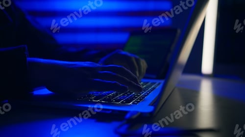 Preview: Hacker with laptop and USA flag in background. Cyber attack concept