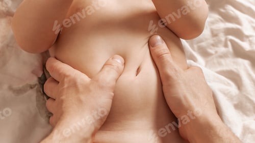 Preview: Massage. Little baby having a massage from his mother with a big pleasure