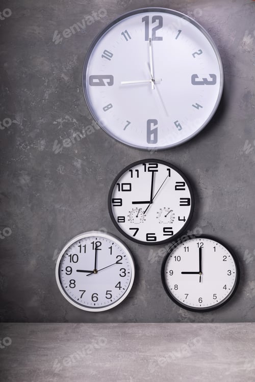 Preview: wall clock at putty concrete painted background