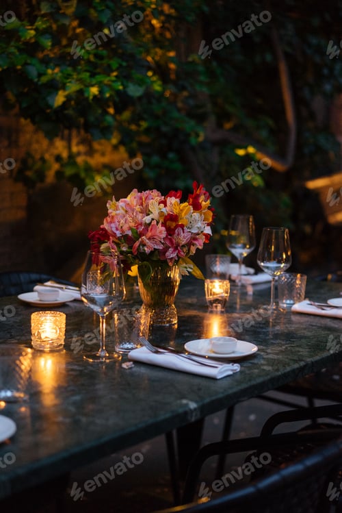 Preview: Elegantly set table at beautiful patio