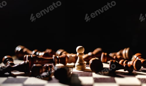 Preview: Winner white pawn surrounded by lying black chess. Leadership, strength and confidence concept