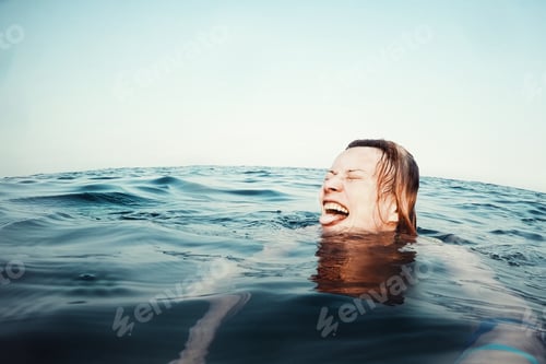 Preview: Happy woman swimming in the sea, selfie portrait by GoPro camera