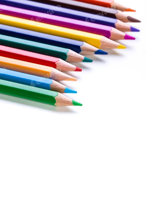 Preview: Colorful collection of sharpened colored pencils arranged in a line on a blank background