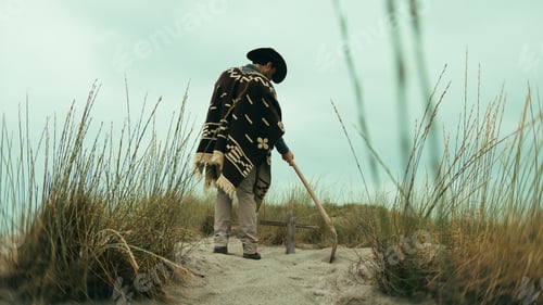 Preview: Cowboy digs a grave in the desert