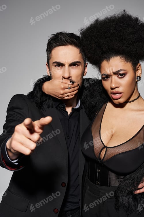 Preview: Passionate and playful couple expressing bold emotions in a stylish urban setting at night