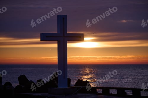 Preview: Christian Holy cross early in the morning at sunrise. The large cross stands on the edge of a