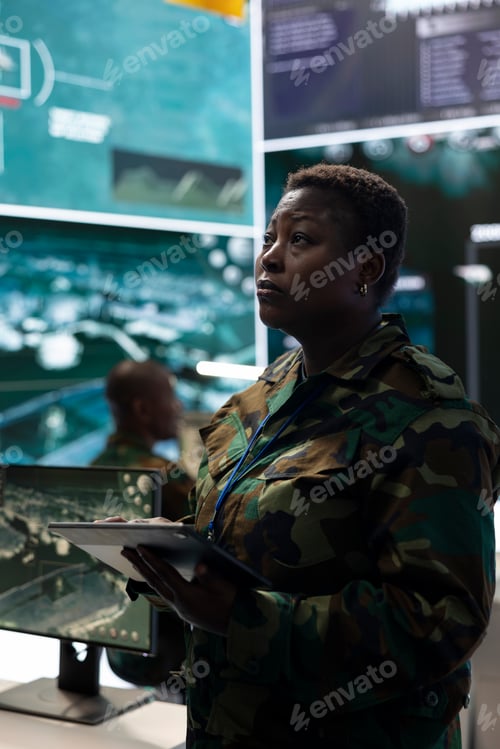 Preview: Woman recruit checking all surveillance footage from satellite CCTV