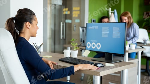 Preview: Businesswoman looks over the annual report figures