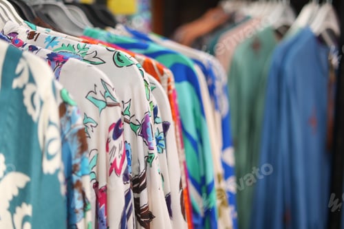 Preview: A Vibrant and Stylish Collection of Colorful Apparel is Showcased on Display Hangers