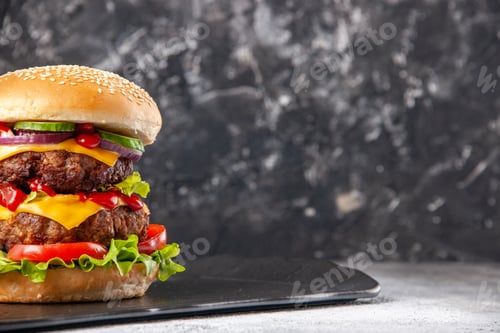 Preview: Top view of delicious homemade sandwich on the right side on gray ice distressed isolated background