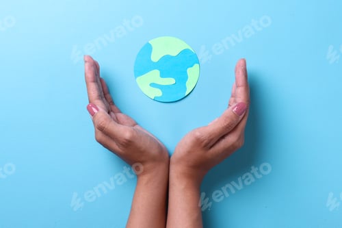 Preview: Palms gesturing protect the globe made from paper