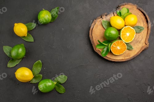 Preview: top view fresh sour lemons on dark background tree fruit citrus limes